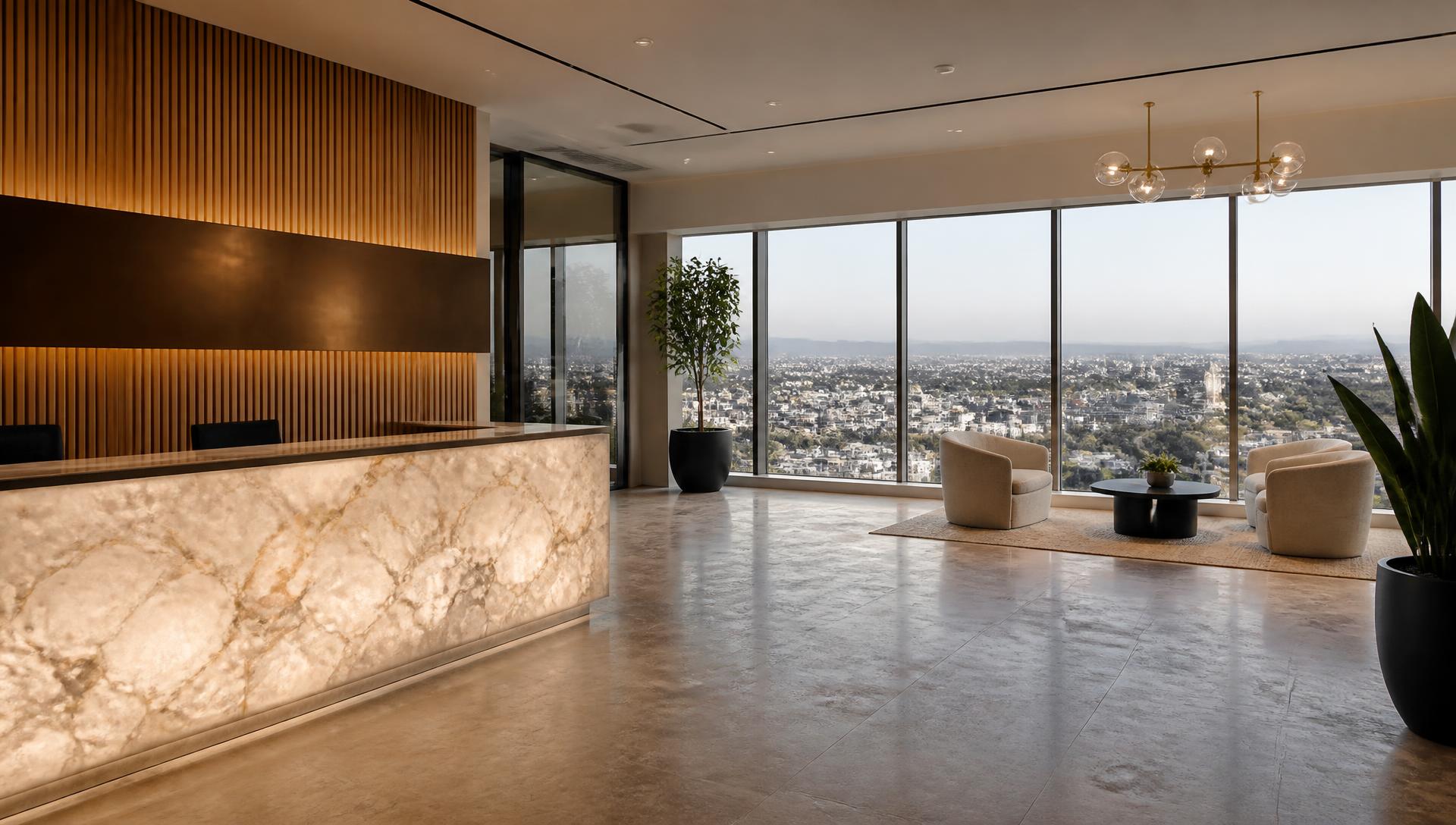 Tenant reception · backlit stone desk and bronze band